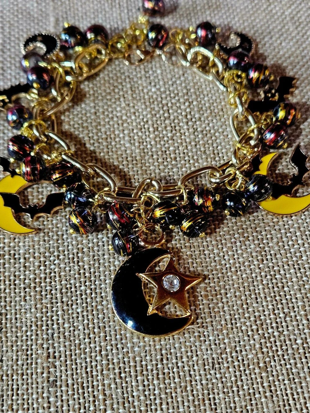 Gold-Tone Moon, Stars And Black Bats Charm Bracelet in Black and Yellow - Picture 6 of 8